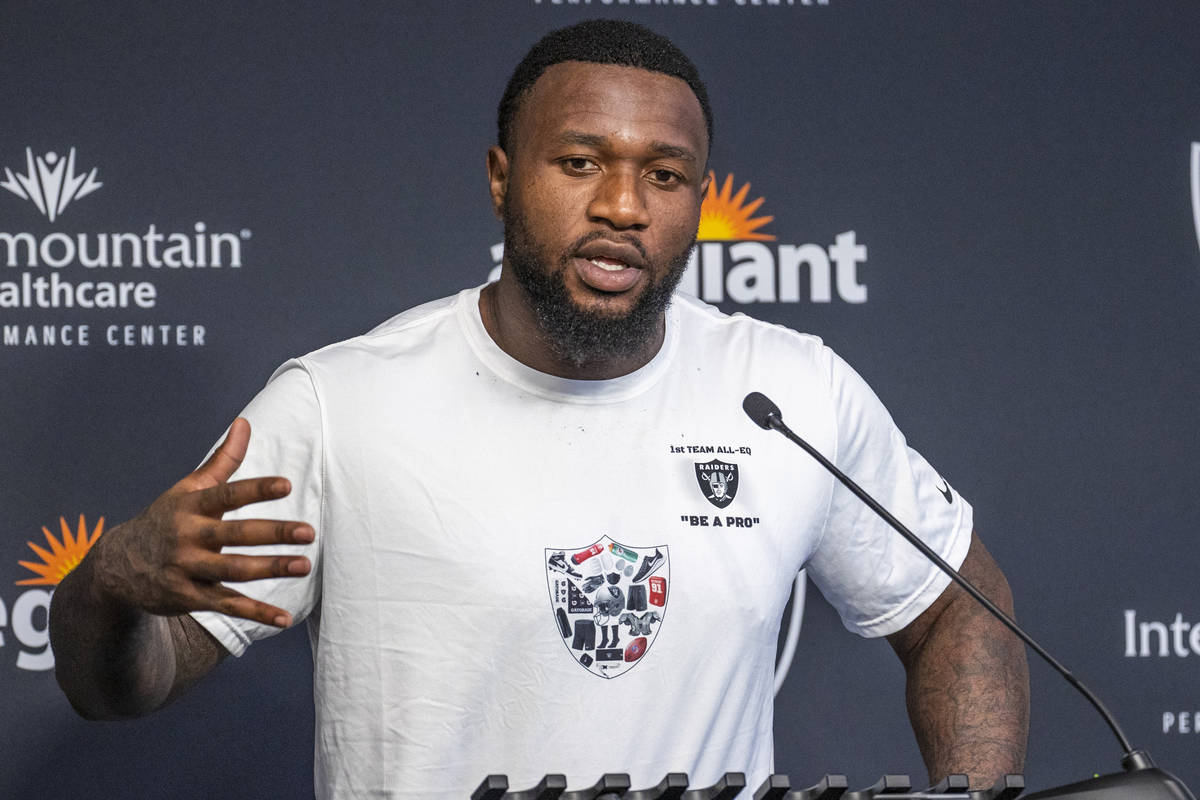Raiders defensive end Yannick Ngakoue (91) answers a media question during training camp at the ...