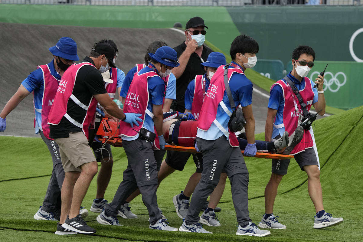 Medics carry away on a stretcher Connor Fields of the United States after he crashed at the fir ...