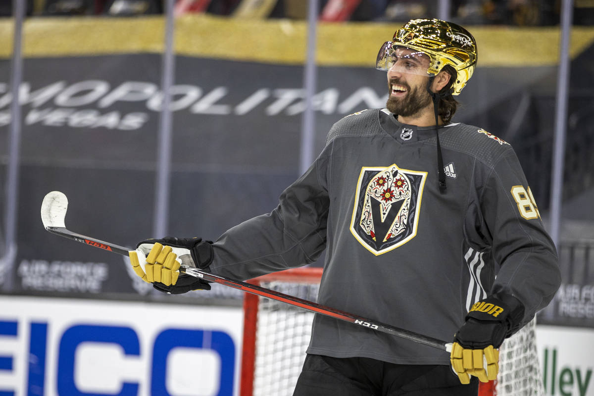 Golden Knights right wing Alex Tuch (89) laughs teammates during the warm-up period of an NHL g ...