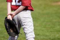 Young baseball player on the field. (Getty Images)