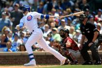 Chicago Cubs' Kris Bryant watches his two-run home run during the first inning of a baseball ga ...