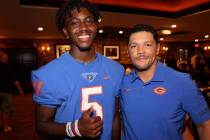 Bishop Gorman coach Brent Browner and safety Zion Branch, 5, pose during Southern Nevada Footba ...