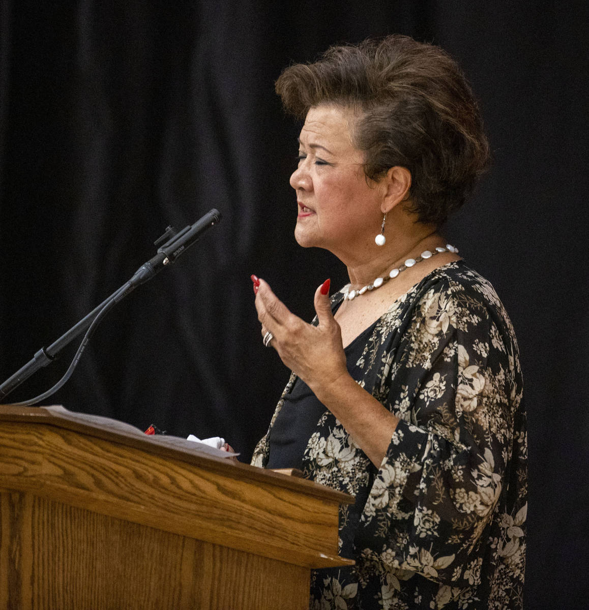 Gloria Caoile, president of the Asian Pacific American Labor Alliance, speaks during a public m ...