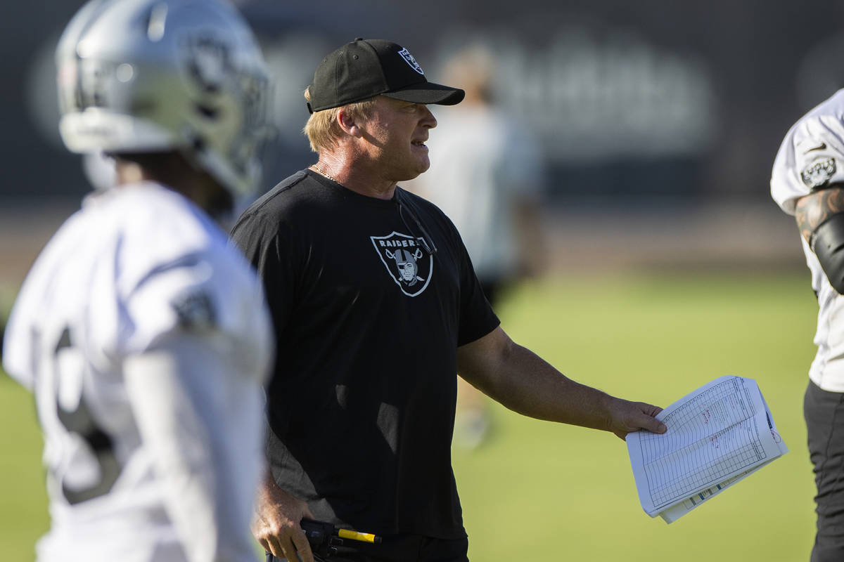 Raiders head coach Jon Gruden, middle, directs practice during training camp on Saturday, July ...