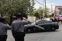 Nevada Highway Patrol troopers salute Nevada Highway Patrol Trooper Micah May's patrol car and ...