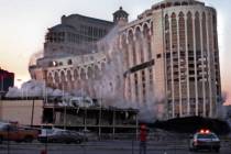 The Aladdin hotel-casino collapses under its own weight as it is imploded on the Las Vegas Stri ...