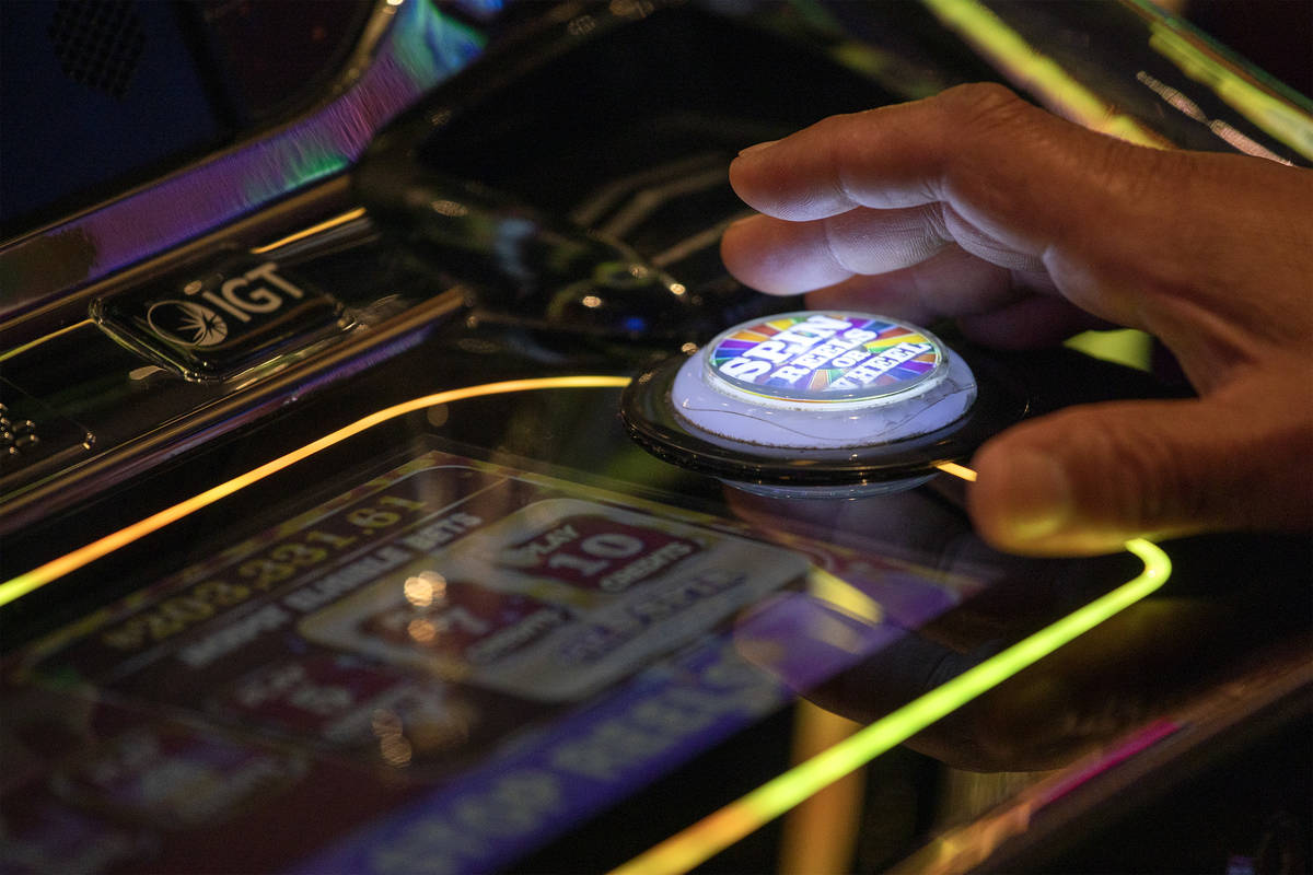 One gambler spins the wheel in the Wheel of Fortune slots zone at the Plaza Hotel and Casino on ...