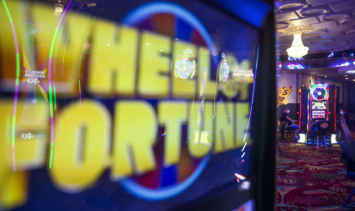 A gambler plays in the Wheel of Fortune slots zone at the Plaza Hotel and Casino on Friday, Jul ...