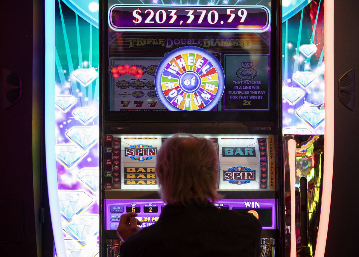 A gambler plays in the Wheel of Fortune slots zone at the Plaza Hotel and Casino on Friday, Jul ...