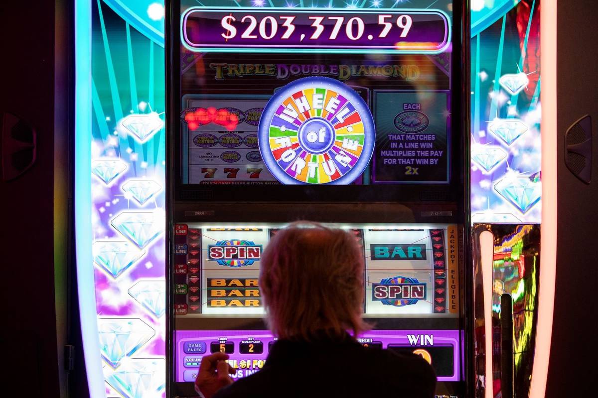A gambler plays in the Wheel of Fortune slots zone at the Plaza Hotel and Casino on Friday, Jul ...