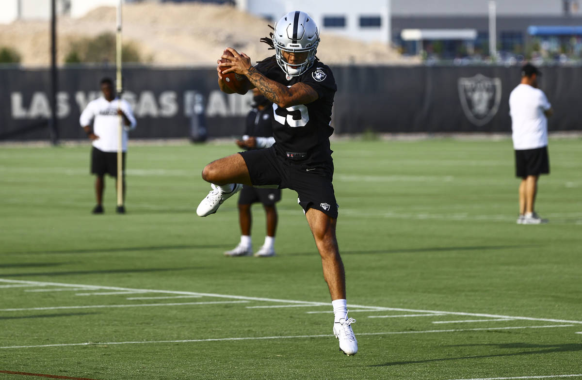 Raiders safety Tre'von Moehrig jumps to make a catch during an NFL football minicamp at Raiders ...