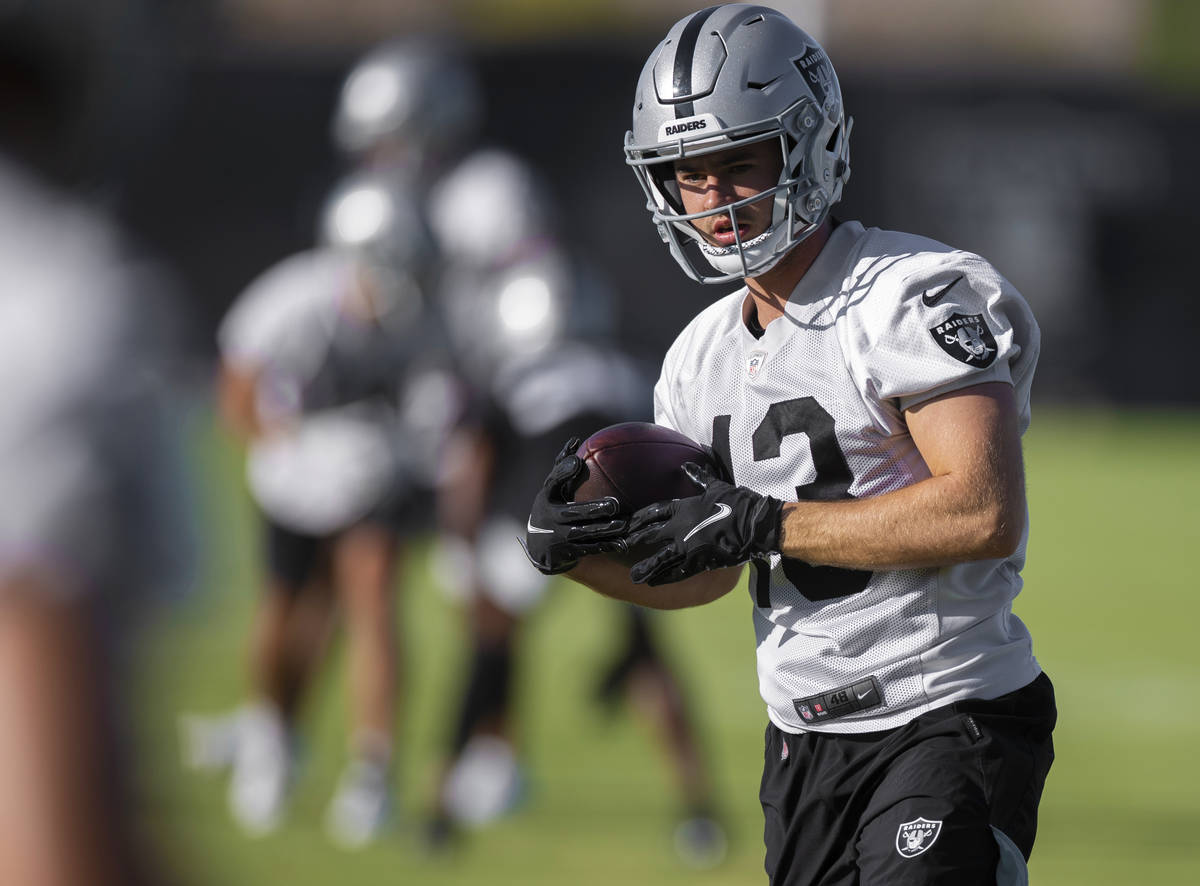 Raiders wide receiver Hunter Renfrow (13) makes a catch during drills at training camp on Monda ...