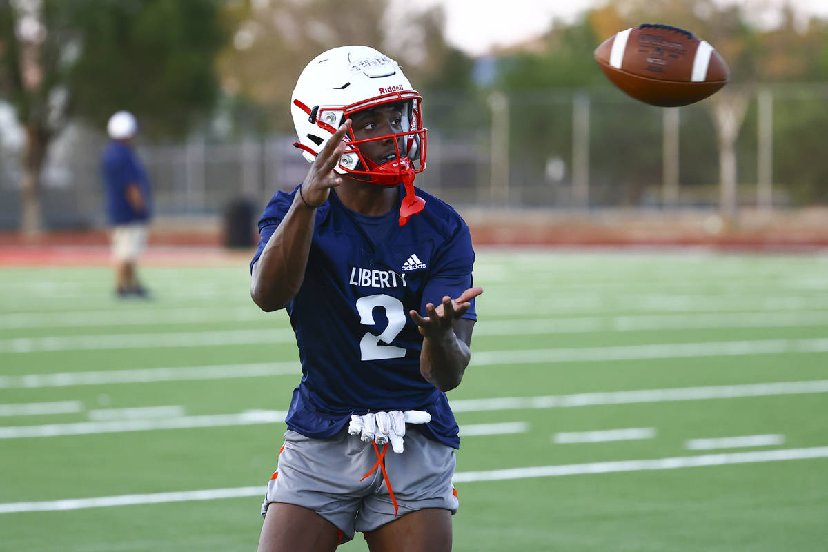 Liberty wide receiver Germie Bernard looks to make a catch during football practice in Henderso ...