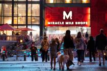 Visitors cross Las Vegas Boulevard toward Miracle Mile Shops on Monday, Nov. 16, 2020, on the L ...