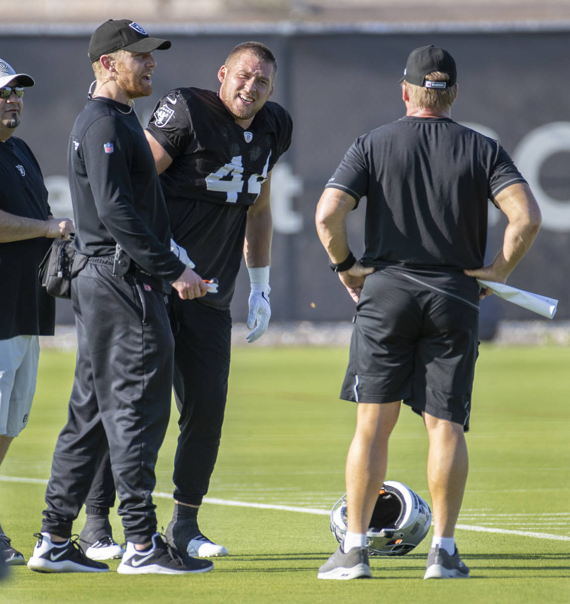 Raiders inside linebacker Nick Kwiatkoski (44, center) talks to Head Coach Jon Gruden, right, a ...
