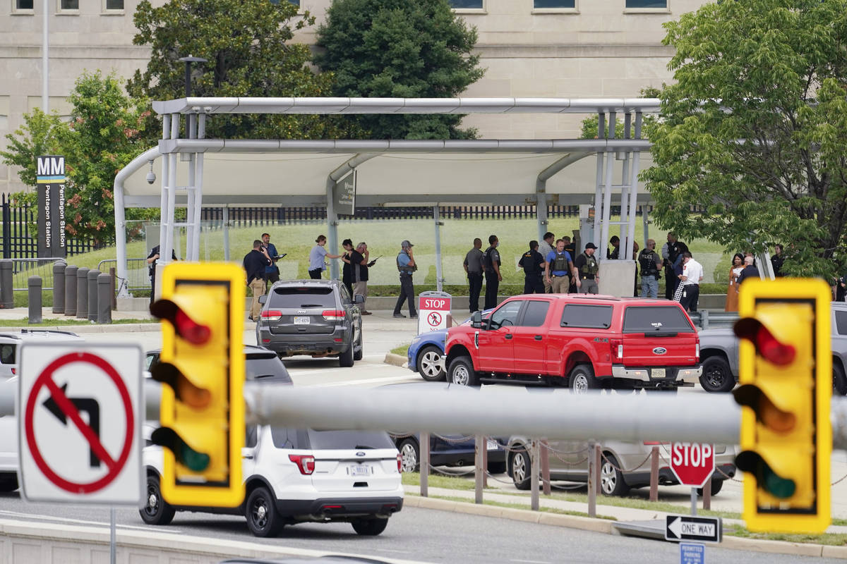 Police vehicles are seen outside the Pentagon Metro area Tuesday, Aug. 3, 2021, at the Pentagon ...