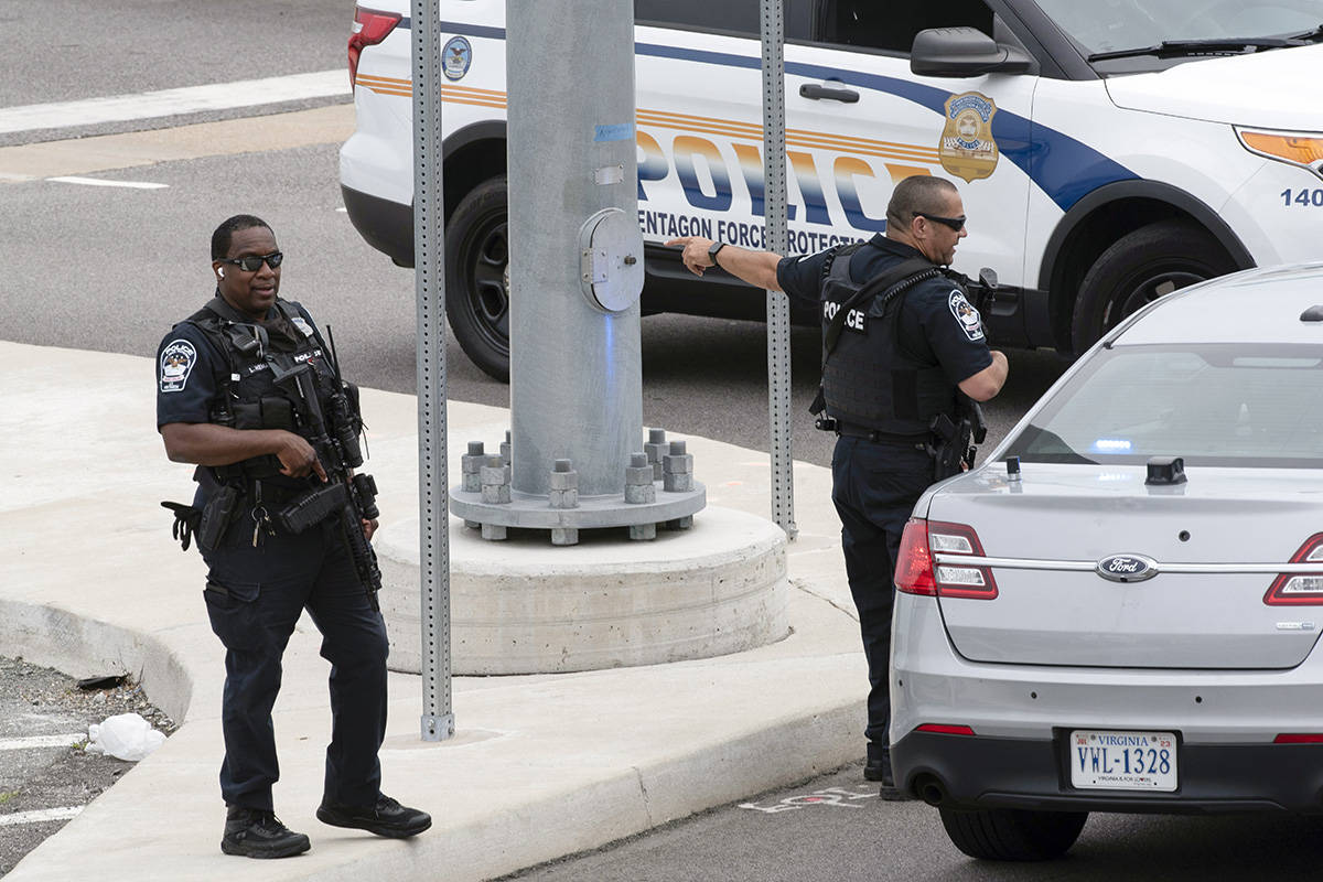 Police secure a parking lot outside the Pentagon Metro area Tuesday, Aug. 3, 2021, at the Penta ...