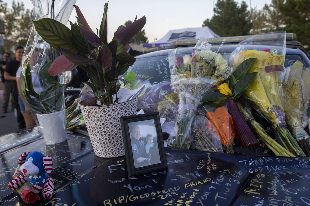 Nevada Highway Patrol trooper Micah May's former squad car is adorned with photos, signatures a ...