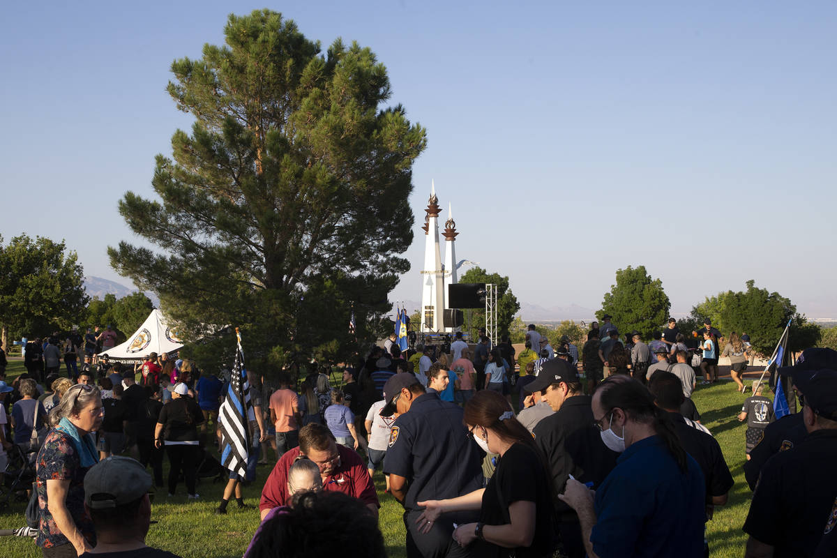 A vigil for Nevada Highway Patrol trooper Micah May takes place at Police Memorial Park on Tues ...