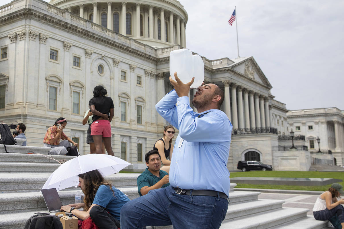 Abbas Alawieh, chief of staff for Rep. Cori Bush, D-Mo., takes a drink of water after sitting o ...