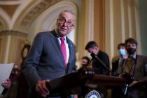 Senate Majority Leader Chuck Schumer, D-N.Y., speaks to reporters as lawmakers work to advance ...