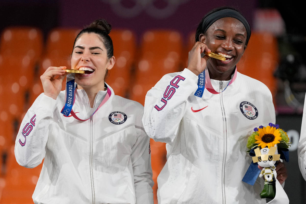 Members of team United States Kelsey Plum, left, and Jackie Young pose with their gold medals d ...