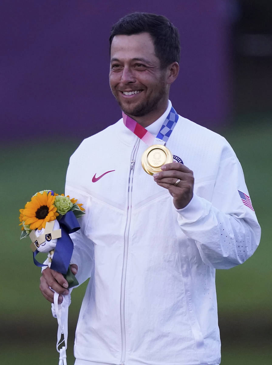 Xander Schauffele of the United States celebrates winning Gold successful  the Men's Golf lawsuit   astatine  the 2 ...