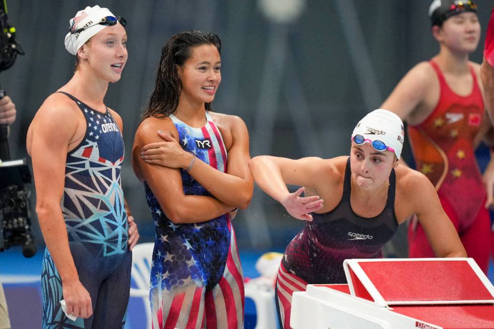 United States women's 4x200-meter freestyle relay team Paige Madden, left, Bella Sims and Kathy ...