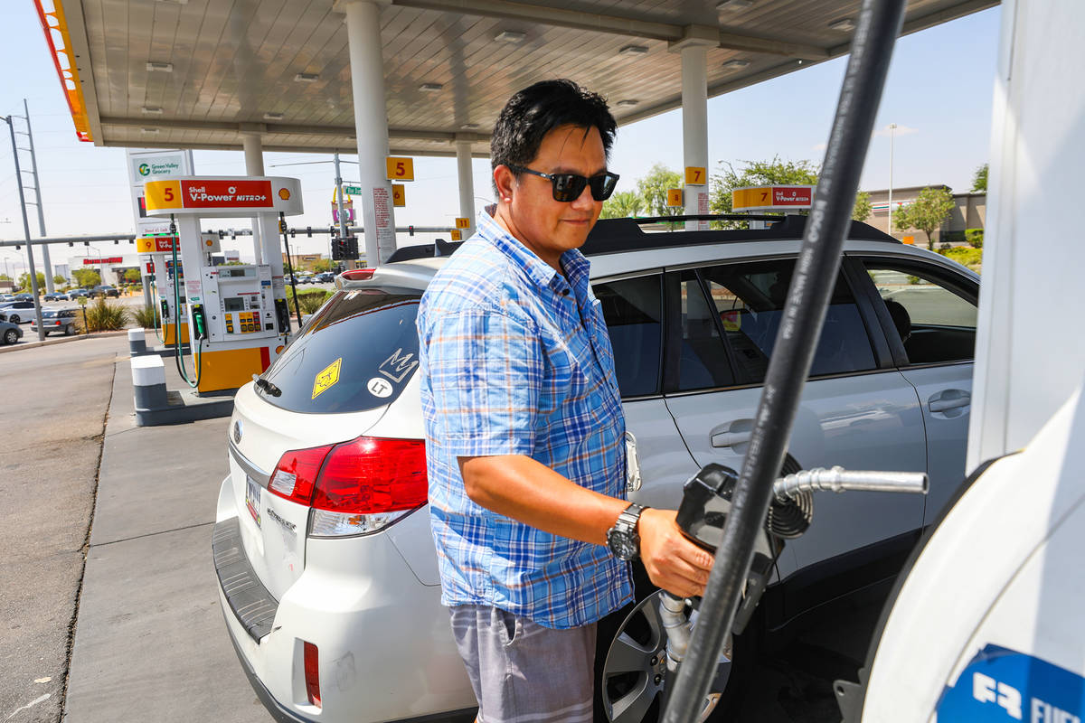 Esteban Prado of Los Angeles fills his car with gas at a Shell station on Blue Diamond in Las V ...