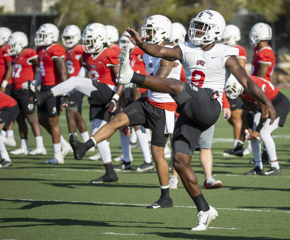 UNLV running back Charles Williams (8) stretches during a drill in football team practice at Re ...