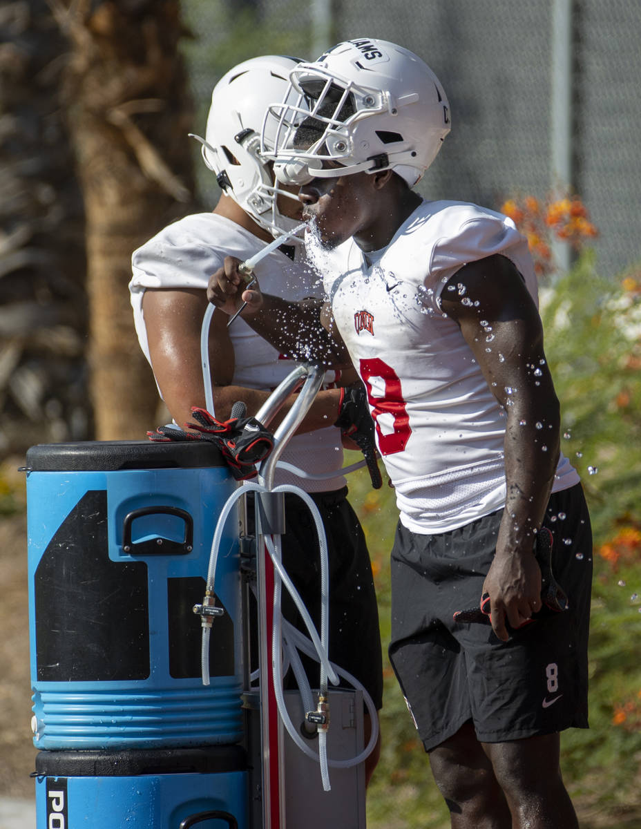 UNLV running back Charles Williams (8) hydrates during football team practice at Rebel Park on ...