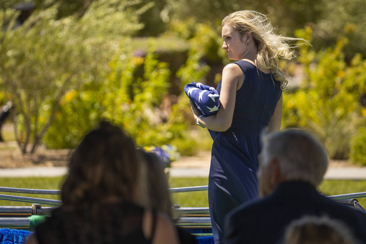 Joanna May, wife of slain Nevada Highway Patrol trooper Micah May, stands besides his casket at ...