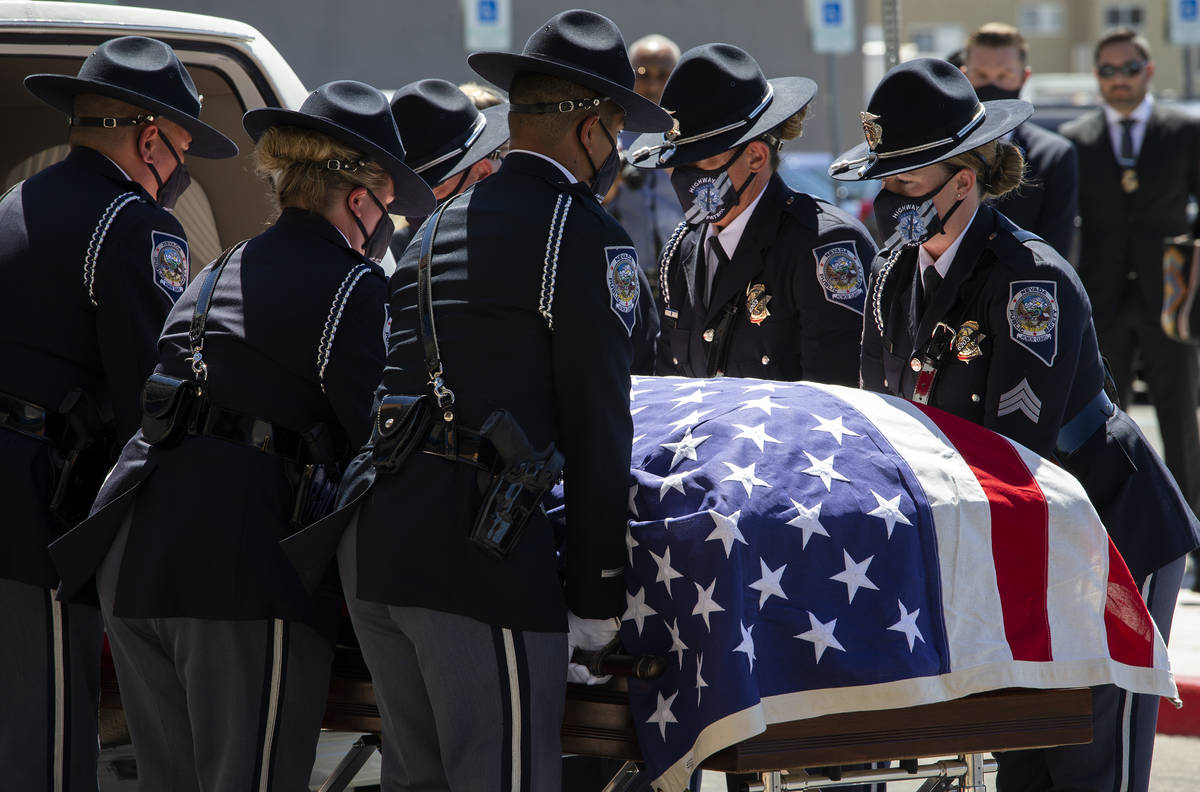 Members of the Honor Guard move Nevada Highway Patrol trooper Micah May's casket into his memor ...