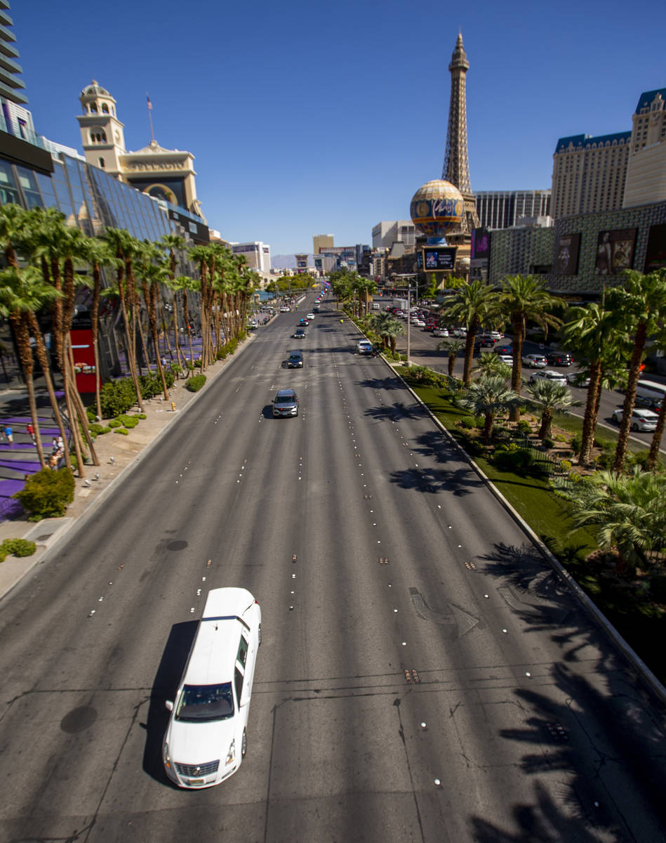 The processional for Nevada Highway Patrol trooper Micah May makes its way down the Strip on Fr ...