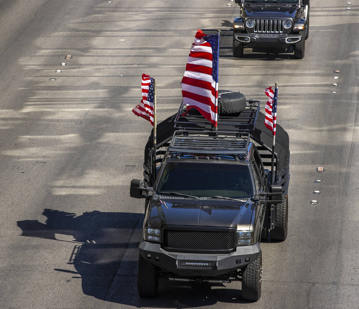 An armored vehicle flies American flags within the processional for Nevada Highway Patrol troop ...