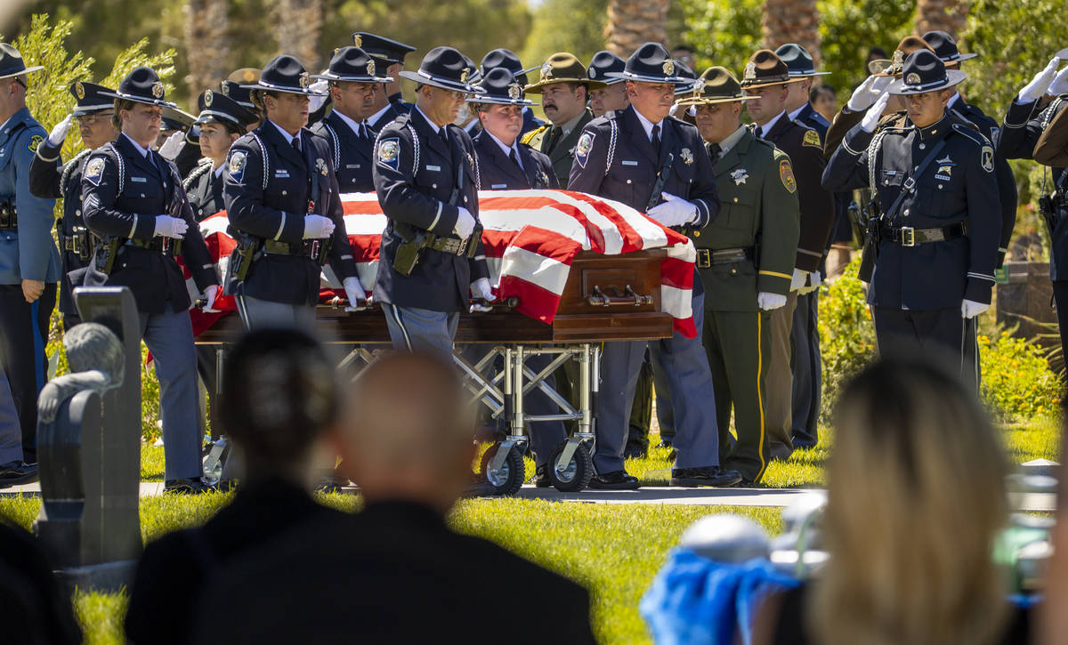 Members of the Nevada Department of Public Safety Honor Guard bring in the casket during a grav ...