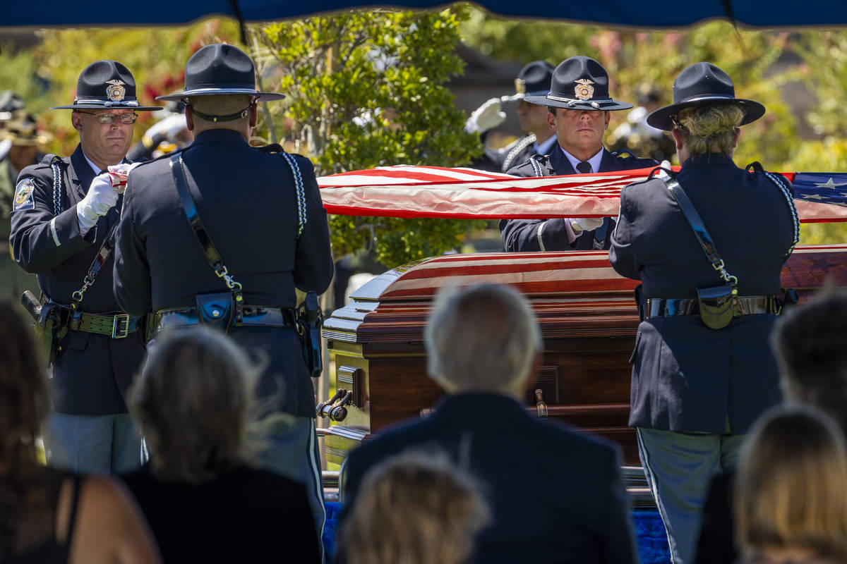 Members of the Nevada Department of Public Safety Honor Guard fold the American flag above the ...