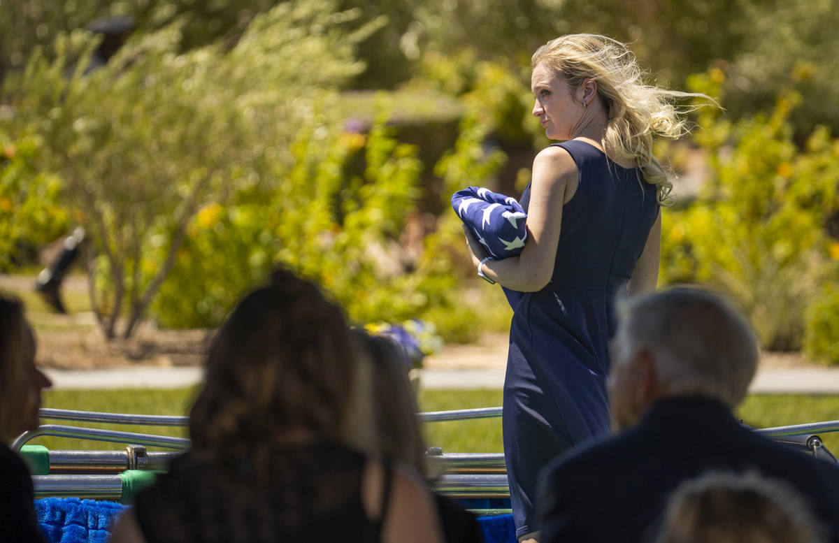 Joanna May, wife of slain Nevada Highway Patrol trooper Micah May, stands besides his casket at ...