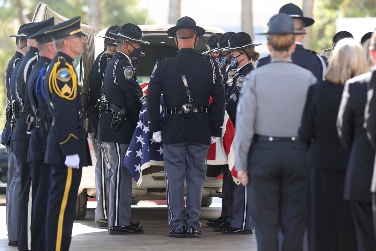 Members of the Nevada Department of Public Safety Honor Guard load the casket of Nevada Highway ...