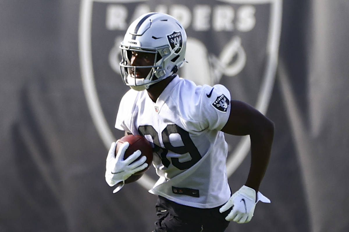 Raiders wide receiver Bryan Edwards runs the ball during an NFL football minicamp at Raiders he ...