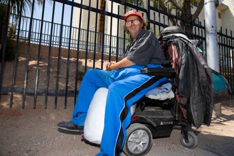 Homeless man Timothy Bartley sits on his wheelchair in front of the Salvation Army in Las Vegas ...