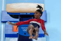 FILE - In this July 27, 2021 file photo, Simone Biles, of the United States, performs on the va ...