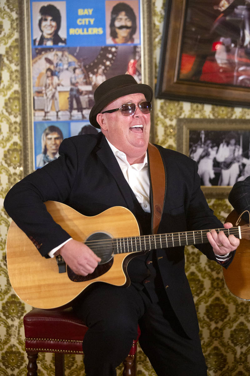 Dave Rooney of The Black Donnellys, a local Irish music duo, plays while filming a documentary ...