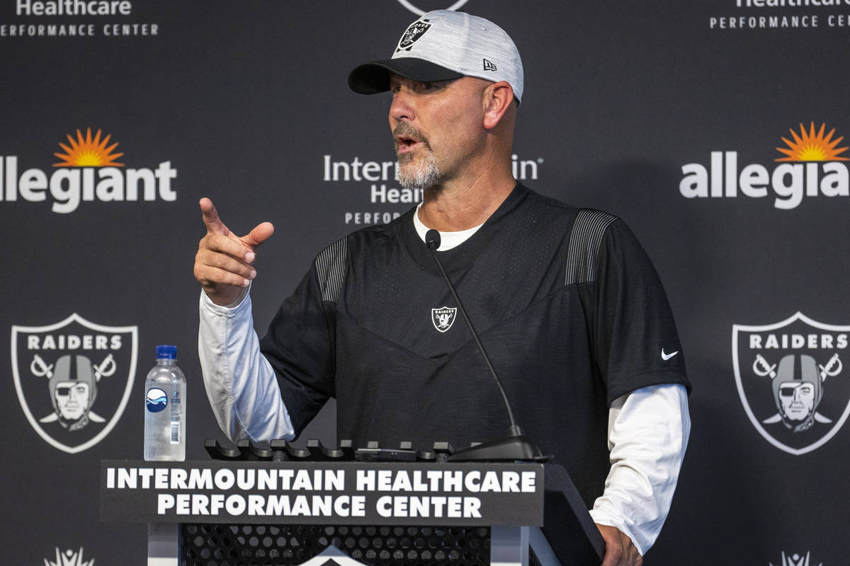 Raiders New Defensive Coordinator Gus Bradley answers a media question during training camp at ...