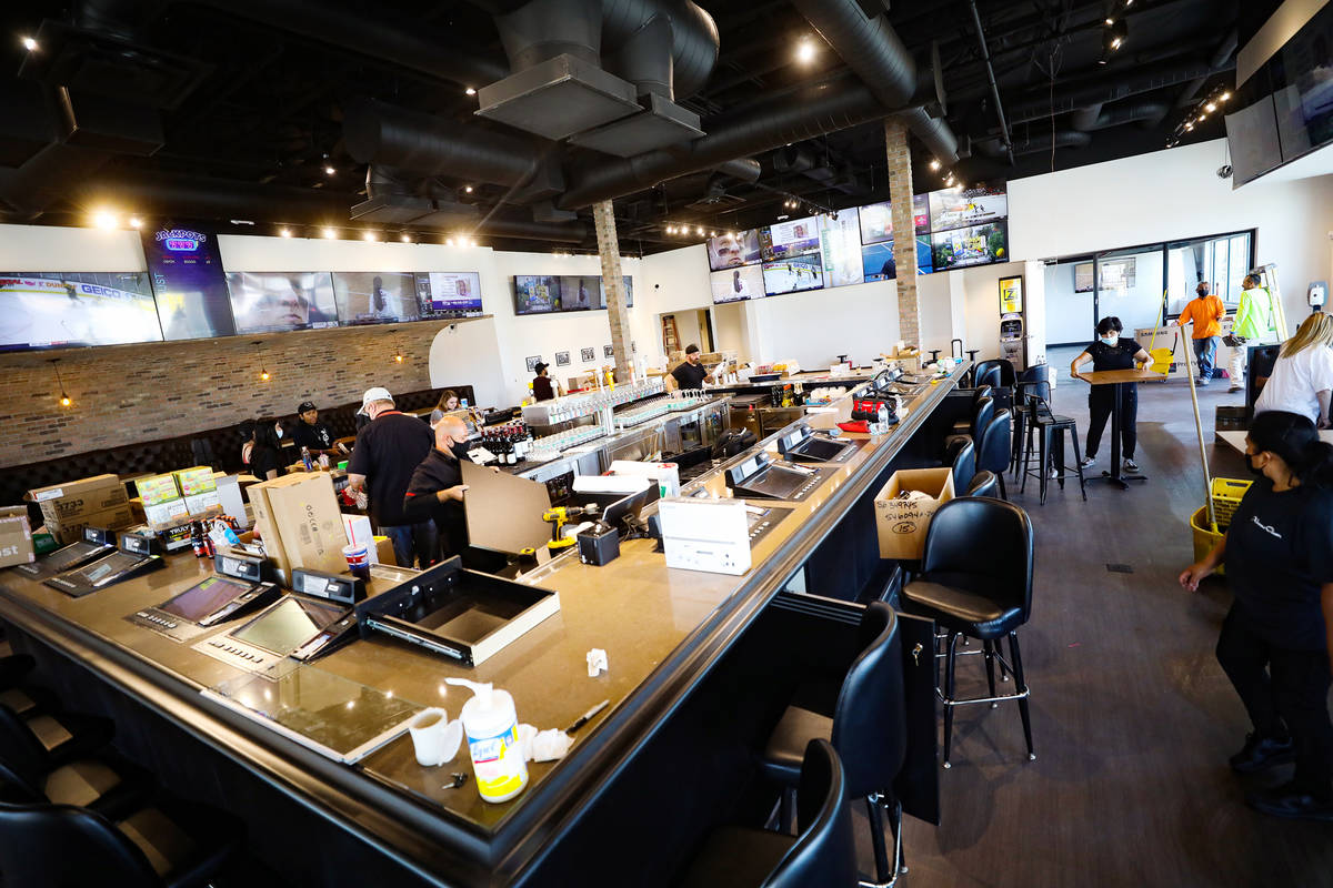 Employees work on the finishing touches of the new PKWY Tavern in Henderson, near St. Rose Park ...