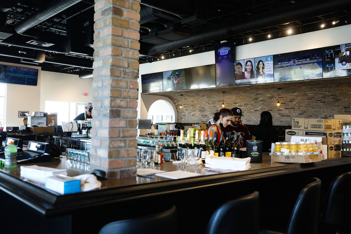 Employees work on the finishing touches of the new PKWY Tavern in Henderson, near St. Rose Park ...