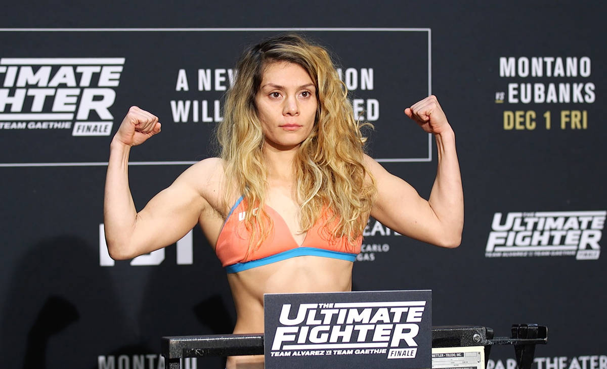 UFC flyweight title contender Nicco Montano on the scale at the TUF 26 Finale official weigh-in ...