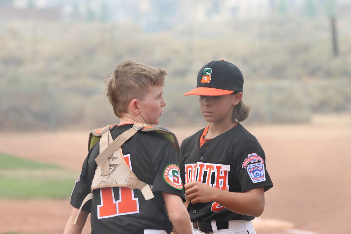 Summerlin South pitcher Stone Amsden talks with catcher Chase Hutton in the state championship. ...