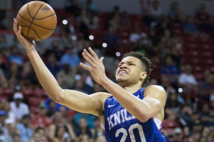 New York Knicks forward Kevin Knox (20) drives past Boston Celtics guard Justin Bibbs (40) in t ...