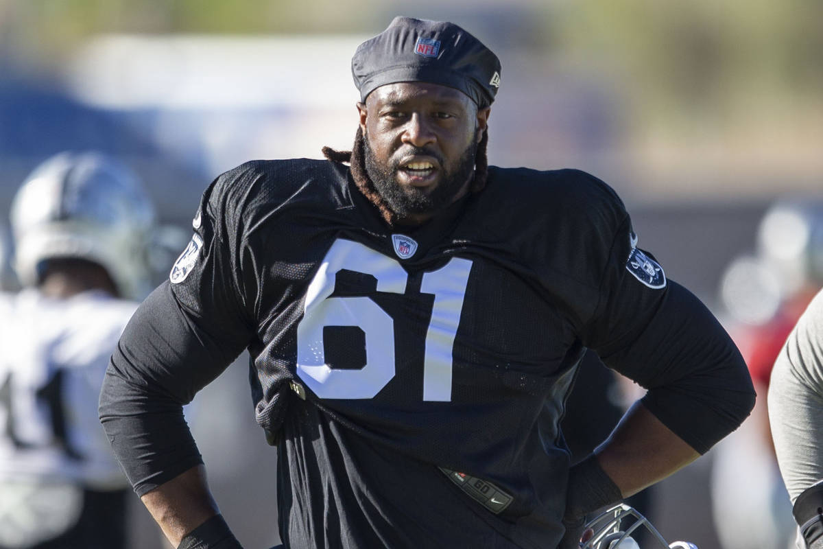 Raiders defensive tackle Gerald McCoy (61) looks on during an NFL training camp practice on Fri ...